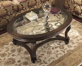 T499-0 Norcastle by Ashley Oval Cocktail Table In Dark Brown